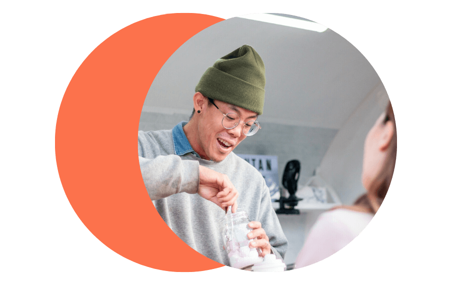 Man picking out marshmallows from a jar